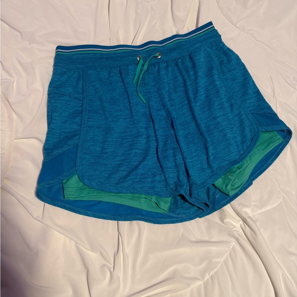 Avia Teal Blue Athletic Shorts with Green inner shorts. Women’s size small. A25